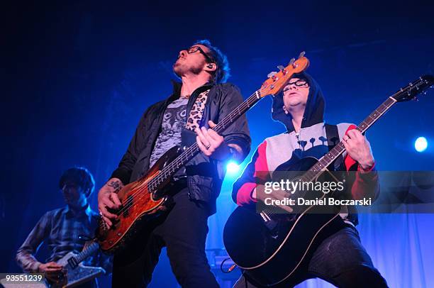 Brian Bell, Scott Shriner and Rivers Cuomo of Weezer perform at the Aragon Ballroom on December 1, 2009 in Chicago, Illinois.