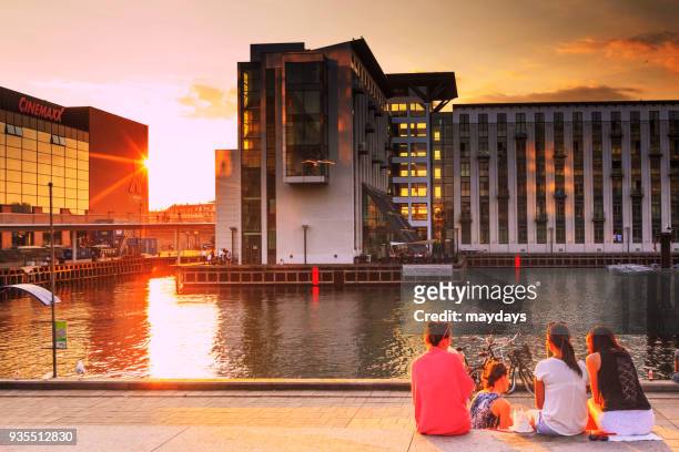sunset in copenhagen - moving down to seated position stock pictures, royalty-free photos & images