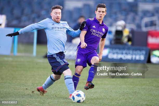 March 11: Will Johnson of Orlando City and Thomas McNamara of New York City challenge for the ball during the New York City FC Vs Orlando City SC...