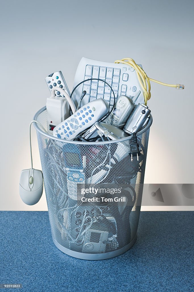 Technology devices in trash can