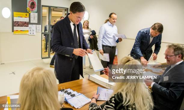 Dutch Prime Minister and The People's Party for Freedom and Democracy leader Mark Rutte casts his vote during the Dutch municipal elections at a...