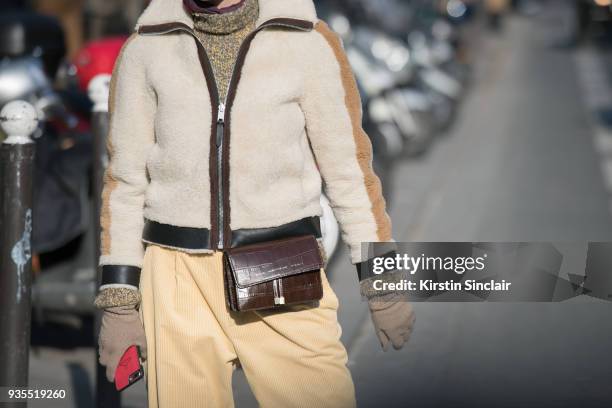 Writer and creative consultant Monica Ainley de La Villardière wears a Coach jacket, CHYLAK bag, Joseph trousers, Uniqlo gloves day 3 of Paris Womens...