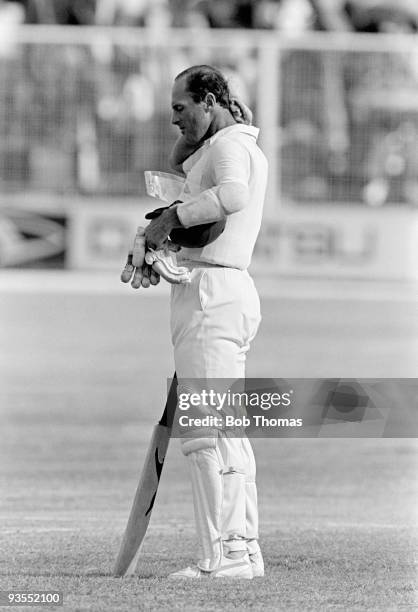 Geoff Boycott of England cools down during a break in play during the fifth day of the 4th West Indies v England Test Match played at St John's,...