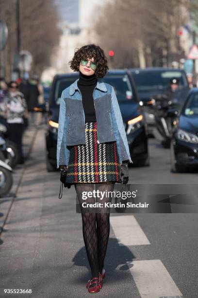 Fashion stylist Chloe Hill wears Gucci tights, Miu Miu skirt, Jerome Dreyfuss bag, Mih Jeans jacket day 3 of Paris Womens Fashion Week Spring/Summer...