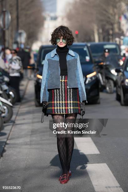 Fashion stylist Chloe Hill wears Gucci tights, Miu Miu skirt, Jerome Dreyfuss bag, Mih Jeans jacket day 3 of Paris Womens Fashion Week Spring/Summer...
