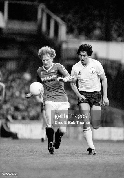 Manchester United's Ashley Grimes is watched closely by Tottenham Hotspur defender Paul Miller during their Division One match played at White Hart...