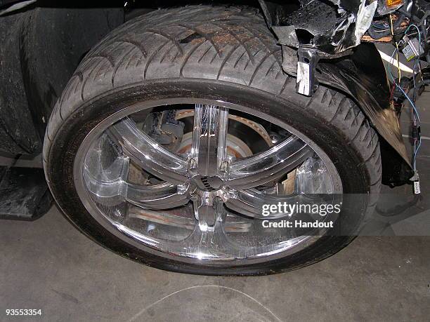In this handout photo provided by The Florida Highway Patrol, a wheel of the vehicle driven by Tiger Woods during his accident is seen on December 2,...