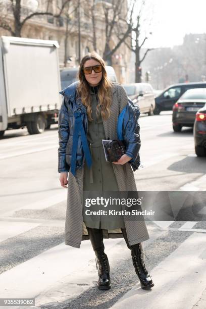 Fashion blogger Sofia Lascurain wears Louis Vuitton shoes and bag, Tommy Hilfiger sunglasses, Zara puffer jacket, H&M coat, Lacoste dress day 3 of...