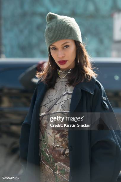 Model Joan Smalls wears a Nina Ricci coat, Under Armour dress day 3 of Paris Womens Fashion Week Spring/Summer 2018, on February 28, 2018 in London,...