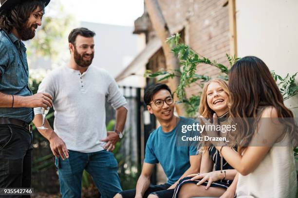 multi ethnic group of beautiful people in australian garden - lifestyle australian stock pictures, royalty-free photos & images