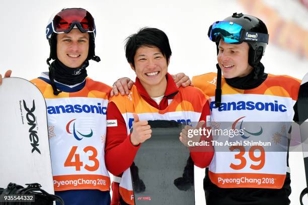 Gold medallist Gurimu Narita of Japan , Silver medallist Evan Strong of USA and Bronze medallist Matti Suur-Hamari of Finland celebrate at the...