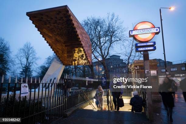 Photographic projections of the victims of the Bethnal Green tube disaster are projected onto the Stairway to Heaven memorial next to the Bethanal...