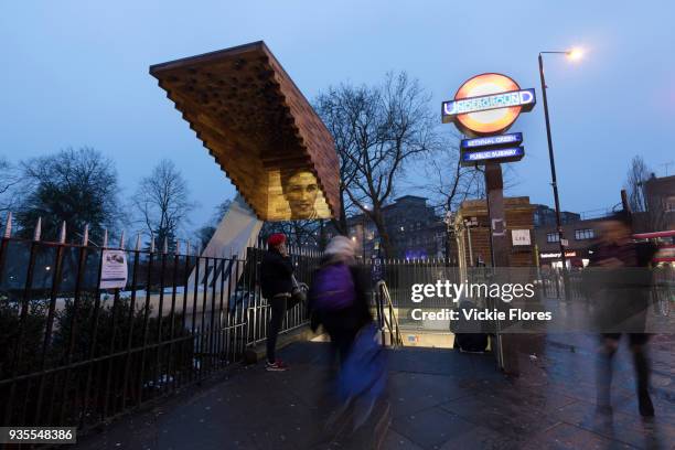 Photographic projections of the victims of the Bethnal Green tube disaster are projected onto the Stairway to Heaven memorial next to the Bethanal...