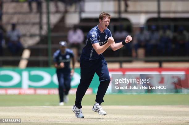 Alasdair Evans of Scotland celebrates the wicket of Jason Holder of the West Indies during The ICC Cricket World Cup Qualifier between the West...