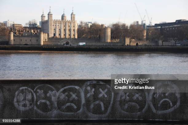 Ativists from the air pollution campaign group Stop Killing Londoners spray paint their message on City Hall and the walls by the Thames on 21st...