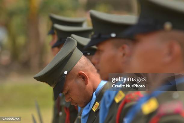 Cadre of National Socialist Council of Nagaland Isak Muivah look down as they stand in formation during the 39th Naga republic day celebration at the...