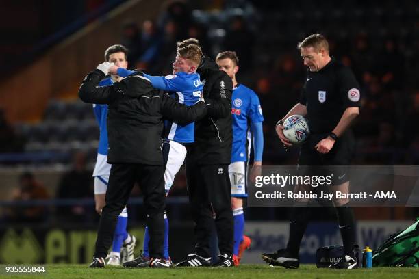 Andy Cannon of Rochdale goes off injured during the Sky Bet League One match between Rochdale and Fleetwood Town at Spotland Stadium on March 20,...