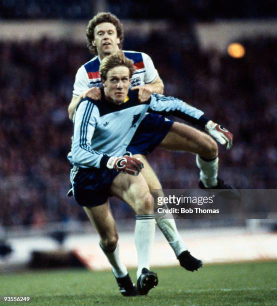 Hans van Breukelen, Holland goalkeeper , is challenged by Tony Woodcock of England during the International Friendly between England and Holland held...