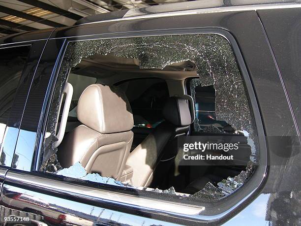 In this handout photo provided by The Florida Highway Patrol, a broken window from the vehicle driven by Tiger Woods during his accident is seen on...