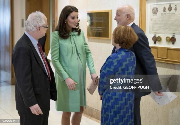 Britain's Catherine, Duchess of Cambridge is greeted by President of the Royal society of Medicine, Sir Simon Charles Wessely , Chief Executive at...