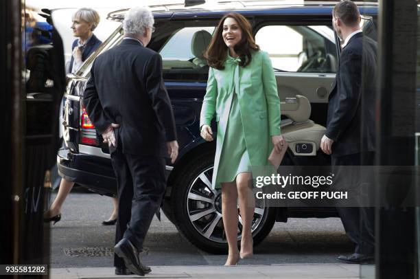 Britain's Catherine, Duchess of Cambridge is greeted by President of the Royal society of Medicine, Sir Simon Charles Wessely on her arrival for a...