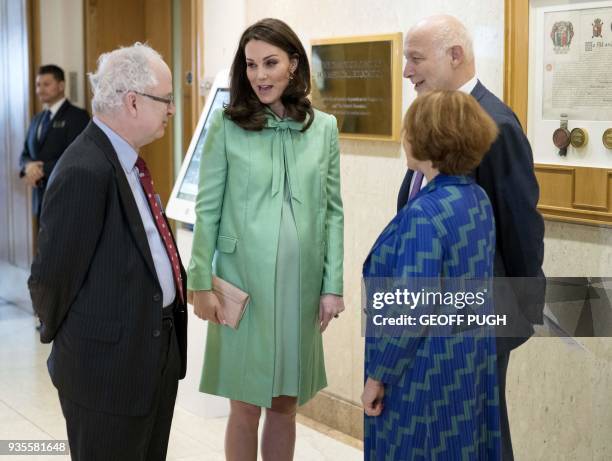 Britain's Catherine, Duchess of Cambridge is greeted by President of the Royal society of Medicine, Sir Simon Charles Wessely , Chief Executive at...