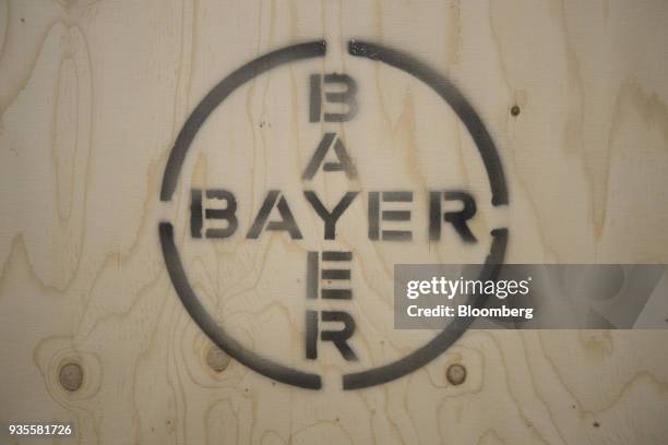 Stenciled Bayer AG logo sits on a crate of rapeseed inside the Bayer CropScience AG processing facility in Monheim, Germany, on Wednesday, March 21,...