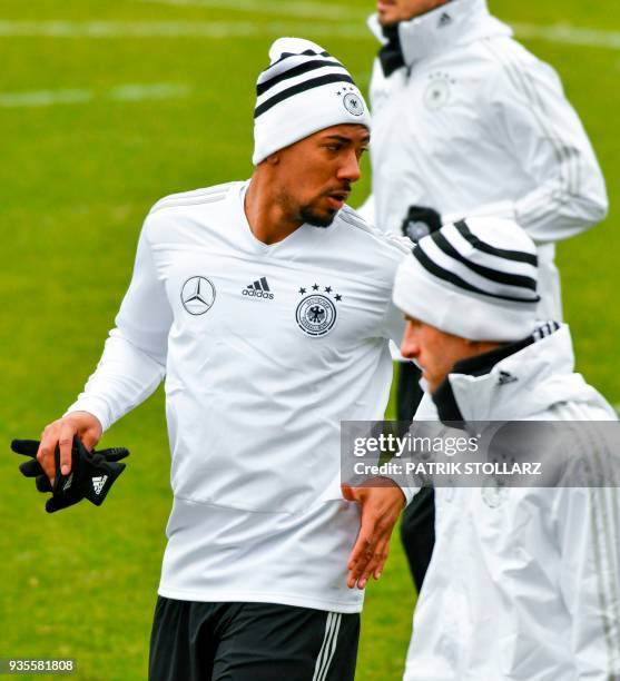 Germany's defender Jerome Boateng warms up during a training session of Germany ahead of their international friendly match against Spain at...