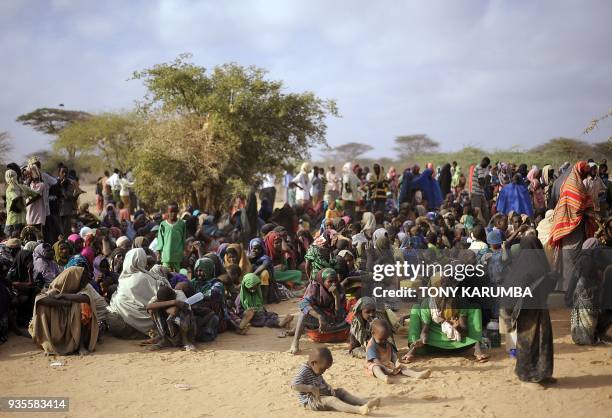 Somali refugees line-up at a registration centre on August 2, 2011 at Dagahaley refugee site within the Dadaab complex to be registered to receive...