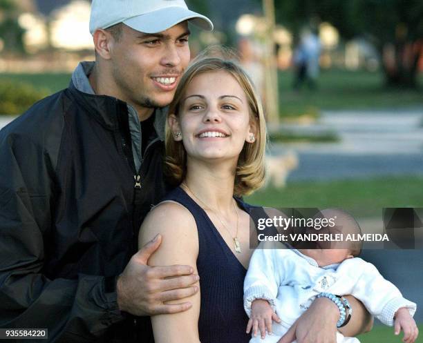 Brazilian soccer player Ronaldo Nazario is shown with his wife, Milene Domingues and son Ronald 29 May 2000 in Rio de Janeiro. The couple have...