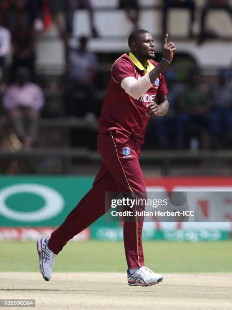 Jason Holder of the West Indies celebrates the wicket of Matthew Cross of Scotland during The ICC Cricket World Cup Qualifier between the West Indies...