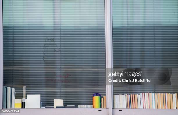 Writing is seen on the window of the floor occupied by company Cambridge Analytica on March 21, 2018 in London, England. UK authorities are currently...