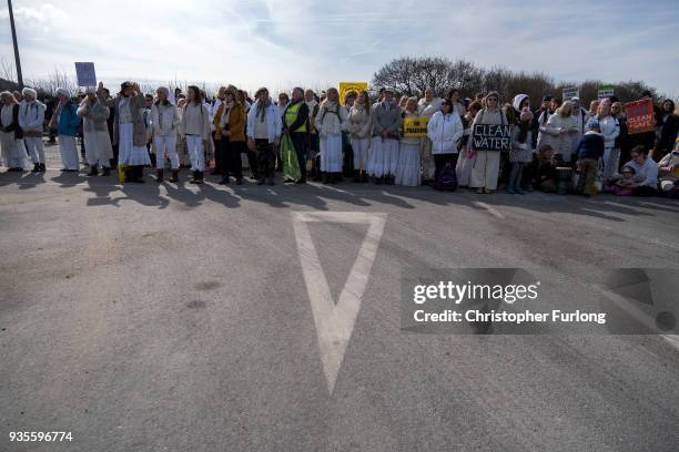 Demonstrators take part in a protest march at the Preston New Road drill site where energy firm Cuadrilla have set up fracking exploration site at...