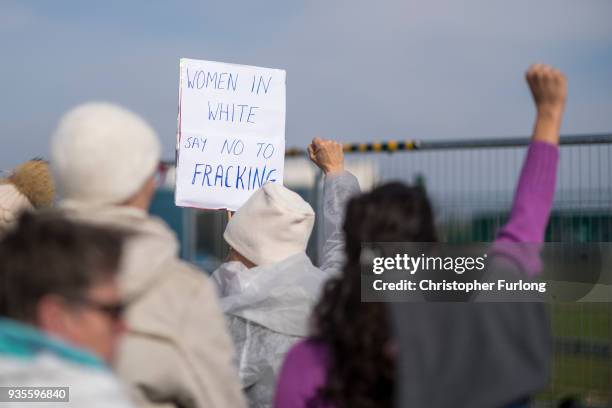 Demonstrators take part in a protest march at the Preston New Road drill site where energy firm Cuadrilla have set up fracking exploration site at...