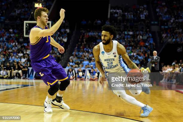 Michael Buckland of the Lipscomb Bisons defends Joel Berry II of the North Carolina Tar Heels during the first round of the 2018 NCAA Men's...