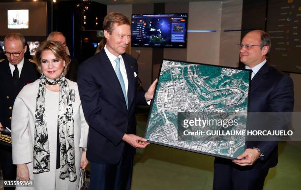 Grand Duchess Maria-Teresa of Luxembourg and Grand Duke Henri of Luxembourg receive a picture showing a satellite view of the city of Luxembourg,...