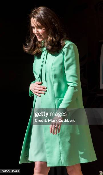 Catherine, Duchess of Cambridge leaves after convening an early intervention for children and families symposium at Royal Society of Medicine on...