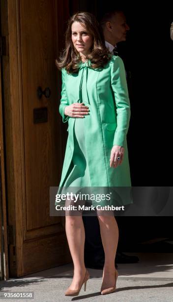 Catherine, Duchess of Cambridge leaves after convening an early intervention for children and families symposium at Royal Society of Medicine on...