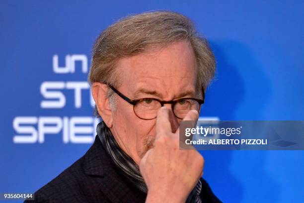 Director Steven Spielberg gestures as he poses during a photocall ahead of the premiere of his last movie "Ready Player One" on March 21, 2018 in...