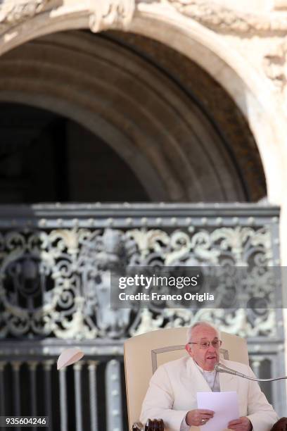 The biretta cup of Pope Francis is blown off his head by a gust of wind as he holds his weekly audience in St. Peter's Square on March 21, 2018 in...