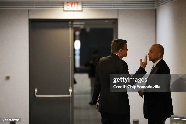 Senate Intelligence Committee ranking member Sen. Mark Warner talks with former Homeland Security Secretary Jeh Johnson before he testifies to the...