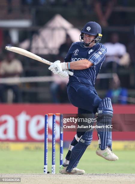 George Munsey of Scotland scores runs during The ICC Cricket World Cup Qualifier between the West Indies and Scotland at The Harare Sports Club on...