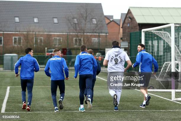 Hughie Fury warms up with Zach Clough, Andrew Taylor, Craig Noone and William Buckley of Bolton during a media workout at Bolton Wanderers FC Academy...