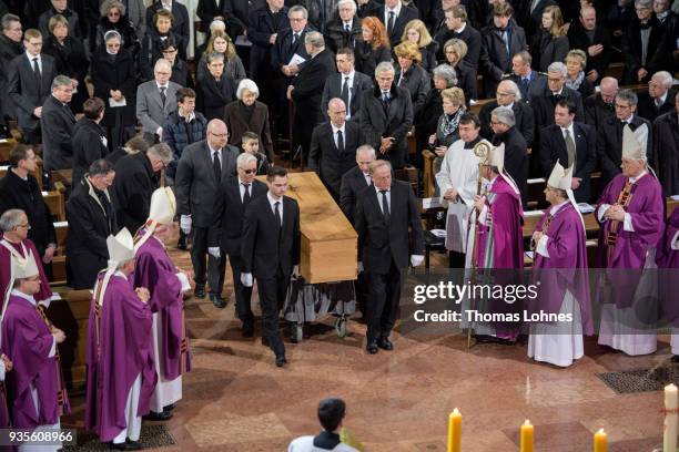 Pallbearers carry the coffin of Cardinal Karl Lehmann into the Mainzer Dom cathedral during the funeral service for Lehmann on March 21, 2018 in...