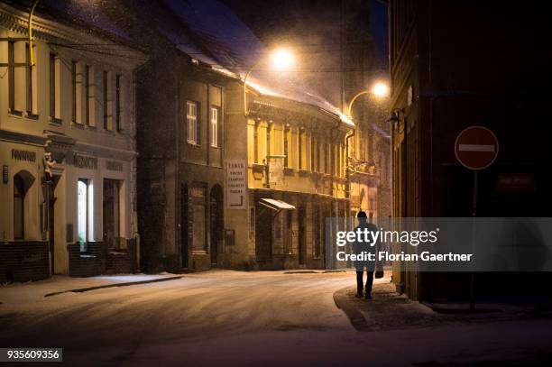 Man with a bag walks the old town on March 17, 2018 in Frydland, Czech Republic.