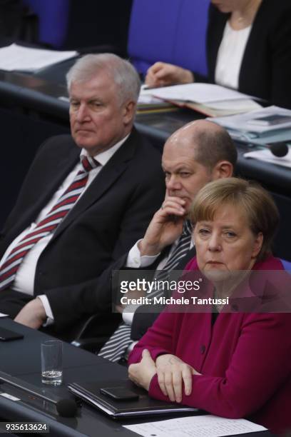 German Chancellor Angela Merkel sits beside Finance Ministry and vice Chancellor, Olaf Scholz and Interior Ministry, Horst Seehofer after she...