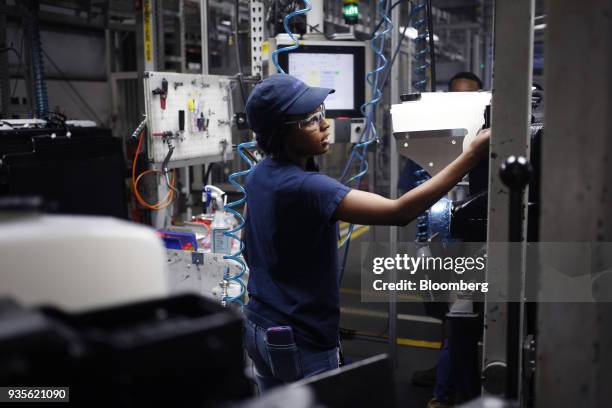 Worker inspects truck engine cooling modules at the MAHLE Behr Charleston Inc. Auto part facility in Charleston, South Carolina, U.S., on Tuesday,...