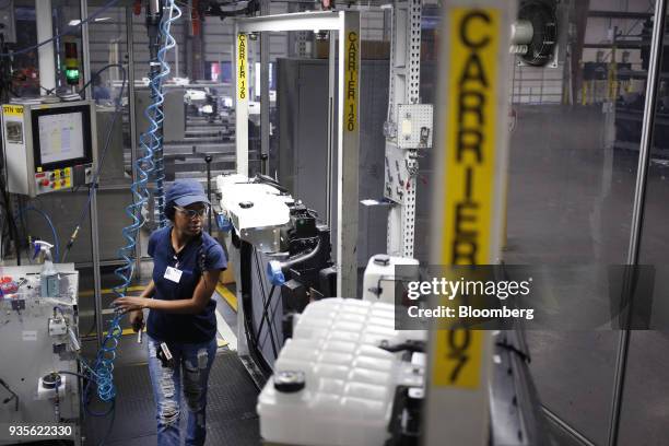 Worker inspects truck engine cooling modules at the MAHLE Behr Charleston Inc. Auto part facility in Charleston, South Carolina, U.S., on Tuesday,...