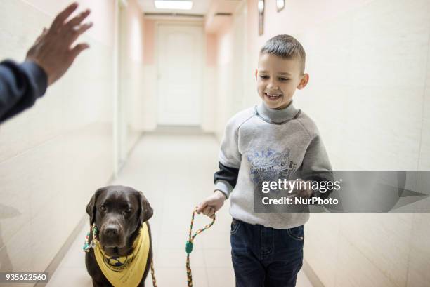 Therapy dog session in Training and Rehabilitation Center for Children with Developmental Disabilities in Fastiv, Kiev Oblast, Ukraine on March 15,...