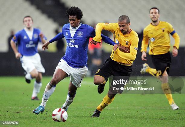 Geraldo of AEK Athens competes with Jo of Everton during the Europa League Match between AEK Athens and Everton at Spyros Louis Stadium, December 2,...